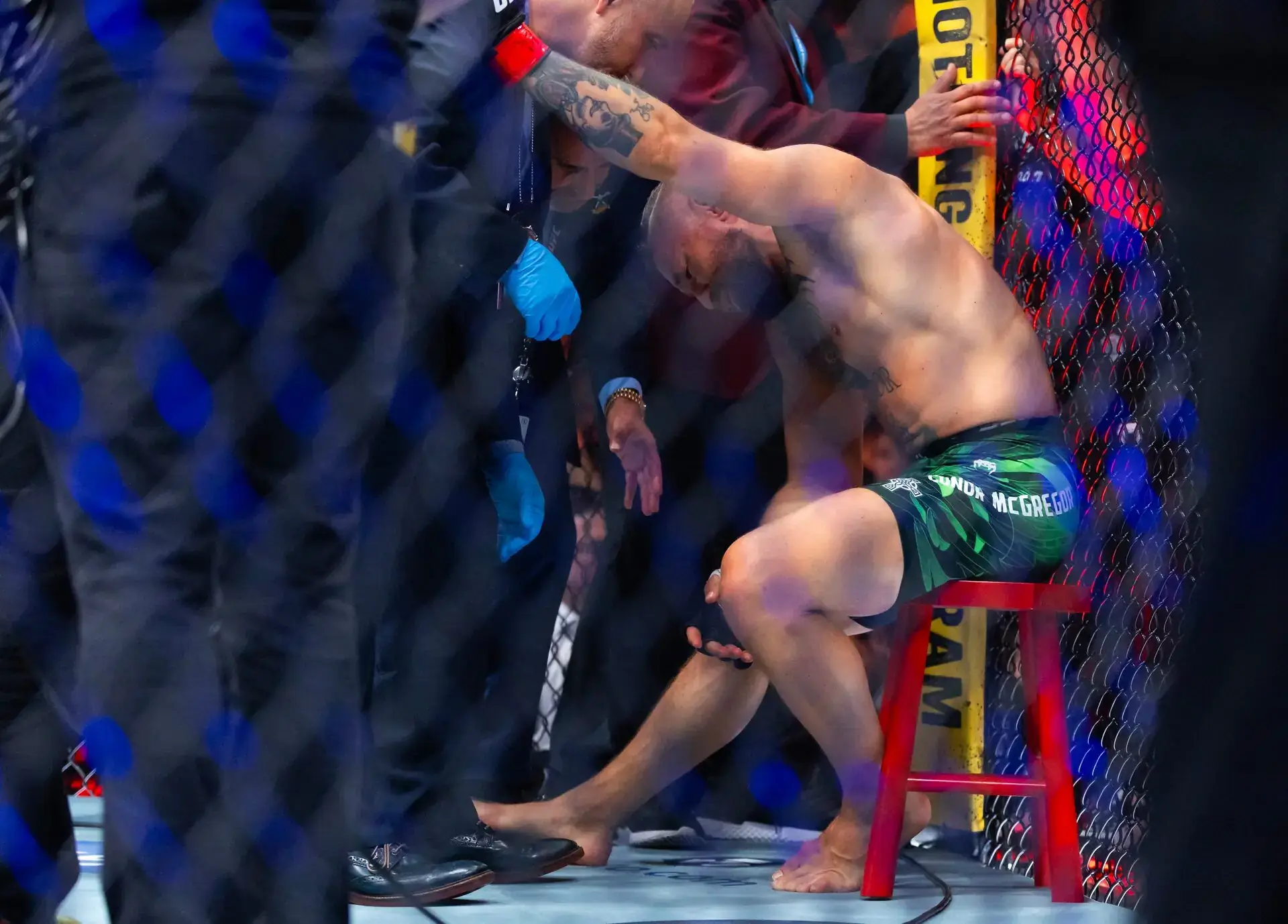 Conor McGregor knee injury UFC 329 octagon